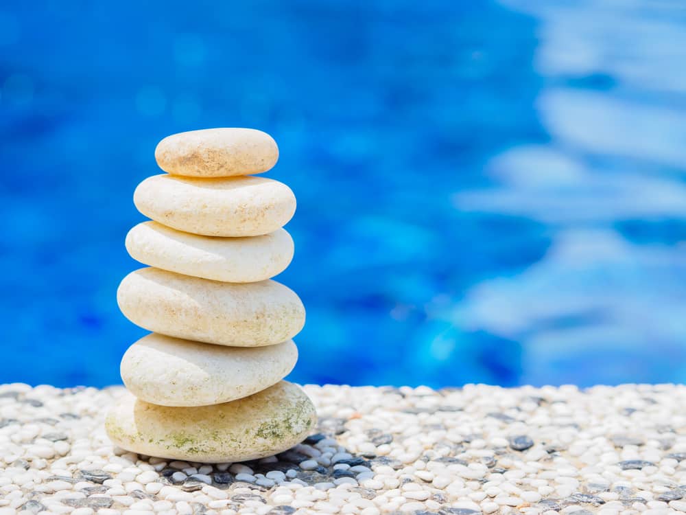 pool deck material white pebble stone