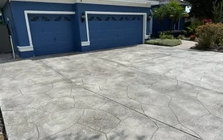 gray paver driveway stamped concrete