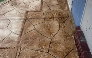 brown stamped concrete pool deck