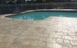stamped concrete pool deck travertine pattern beige