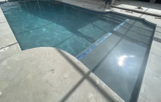 Backyard Pool Resurfacing With New Surface and Water Features