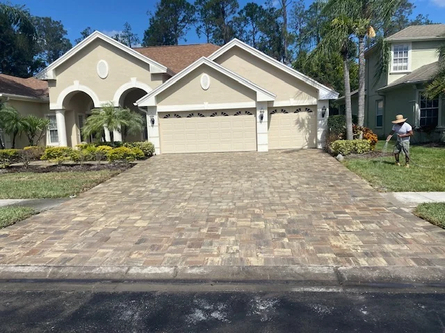 Driveway With Pavers and Pressure Washing in Action