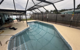 Screen Enclosed Swimming Pool with Freshly Poured Concrete
