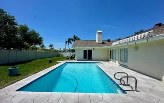 backyard pool with stamped concrete
