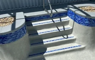 resurfaced pool steps blue tiles