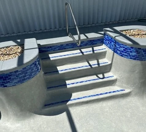 resurfaced pool steps blue tiles