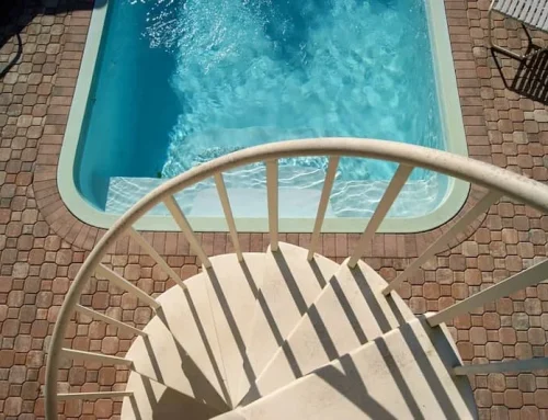 Pebble Stone Pool Deck vs. Stamped Concrete: Which Wins?