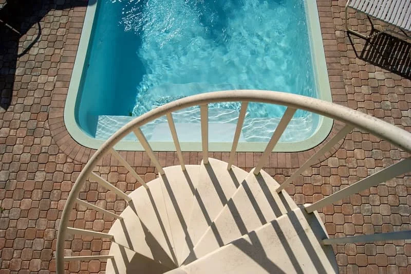 Pebble Stone Pool Deck vs. Stamped Concrete